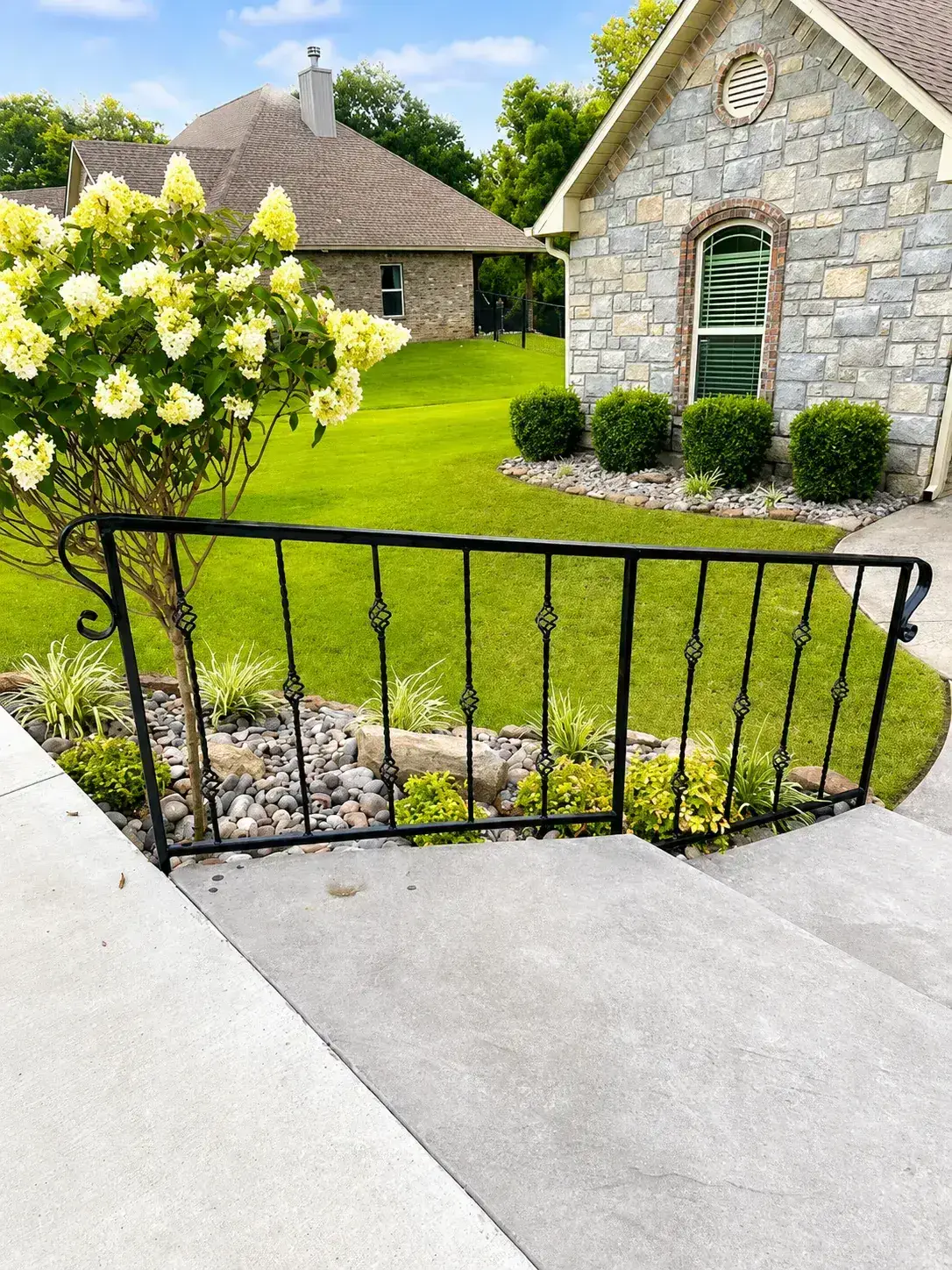 Close-up of custom ornamental iron railing with basket twist detail